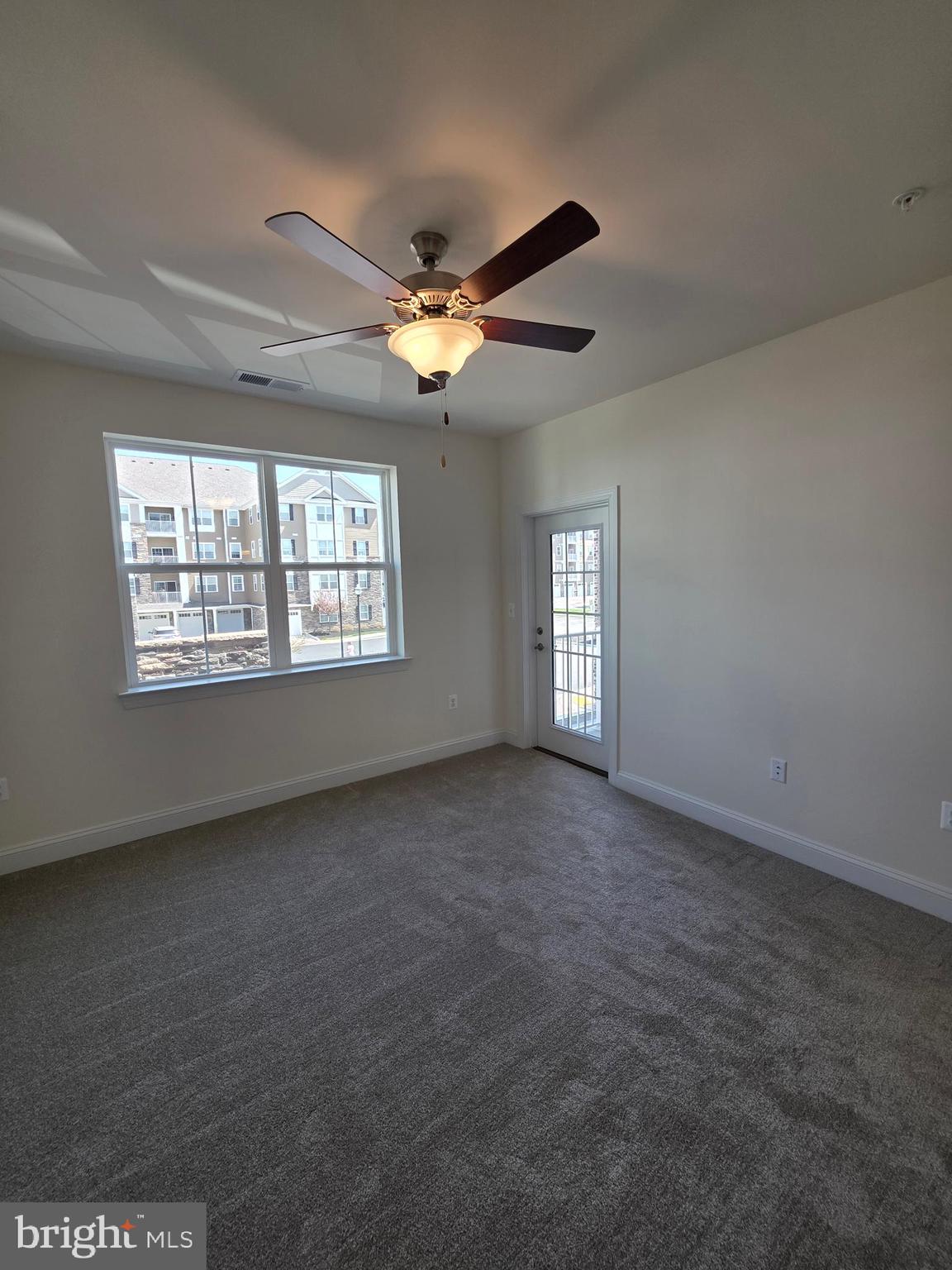 404 Bold Ruler Court, Unit 204 Havre de Grace, MD 21078 - Photo 25 of 31 a view of empty room with windows and ceiling fan