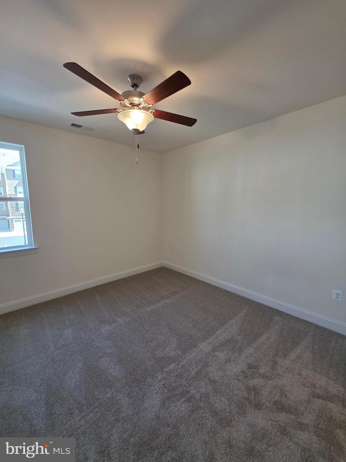 404 Bold Ruler Court, Unit 204 Havre de Grace, MD 21078 - Photo 28 of 31 an empty room with windows and fan