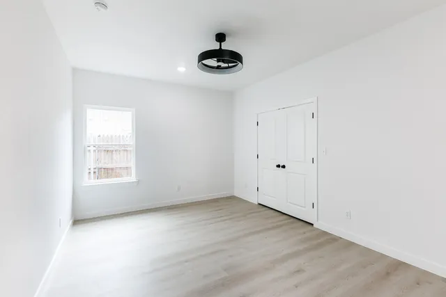 a view of an empty room with a window