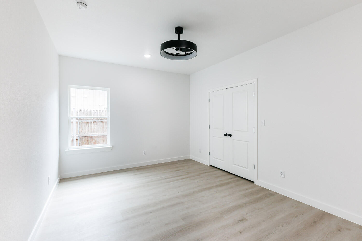 1704 Elkhart Avenue, Unit A Lubbock, TX 79416 - Photo 19 of 44 a view of an empty room with a window