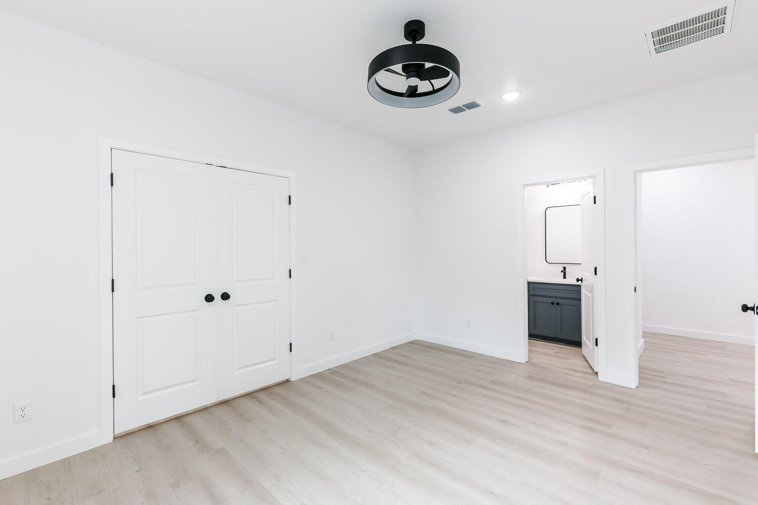 1704 Elkhart Avenue, Unit A Lubbock, TX 79416 - Photo 20 of 44 a view of an empty room with wooden floor