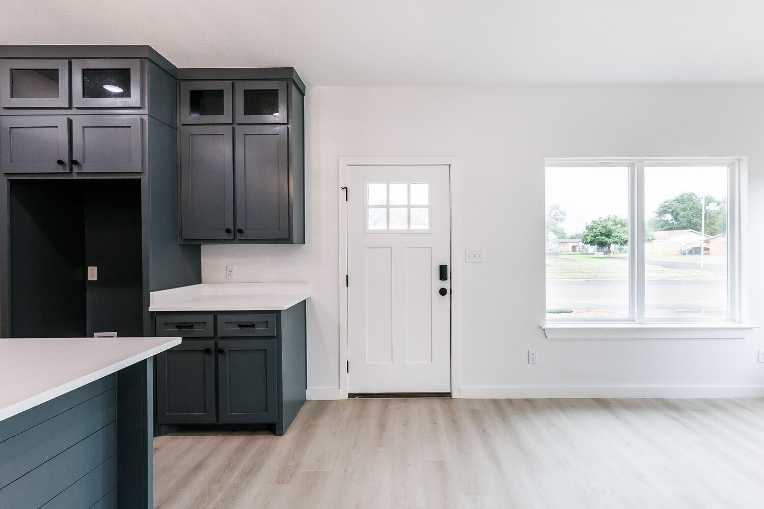 1704 Elkhart Avenue, Unit A Lubbock, TX 79416 - Photo 2 of 44 a kitchen with kitchen island granite countertop a sink cabinets and stainless steel appliances