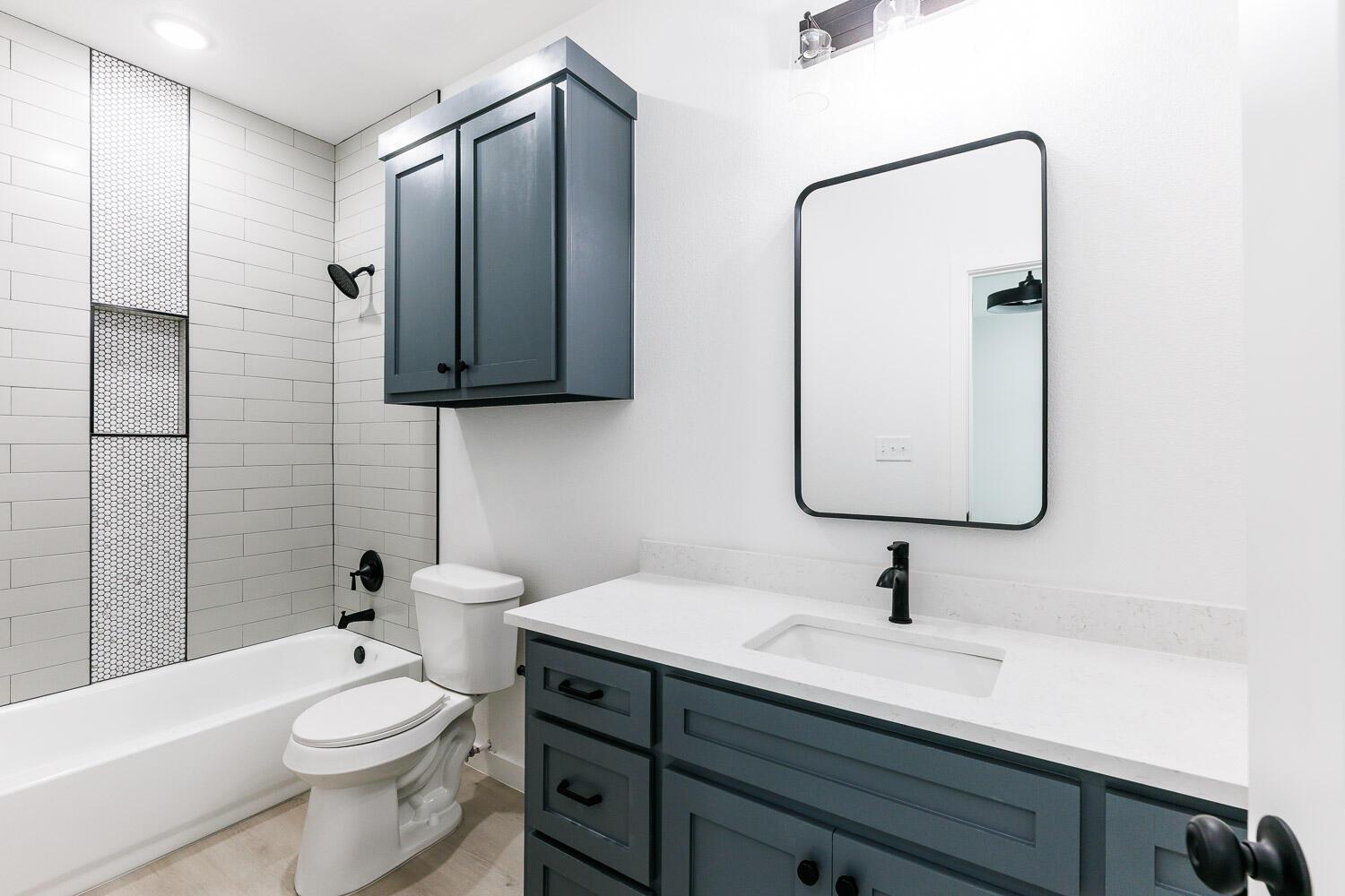 1704 Elkhart Avenue, Unit A Lubbock, TX 79416 - Photo 25 of 44 a bathroom with a toilet sink double vanity and shower