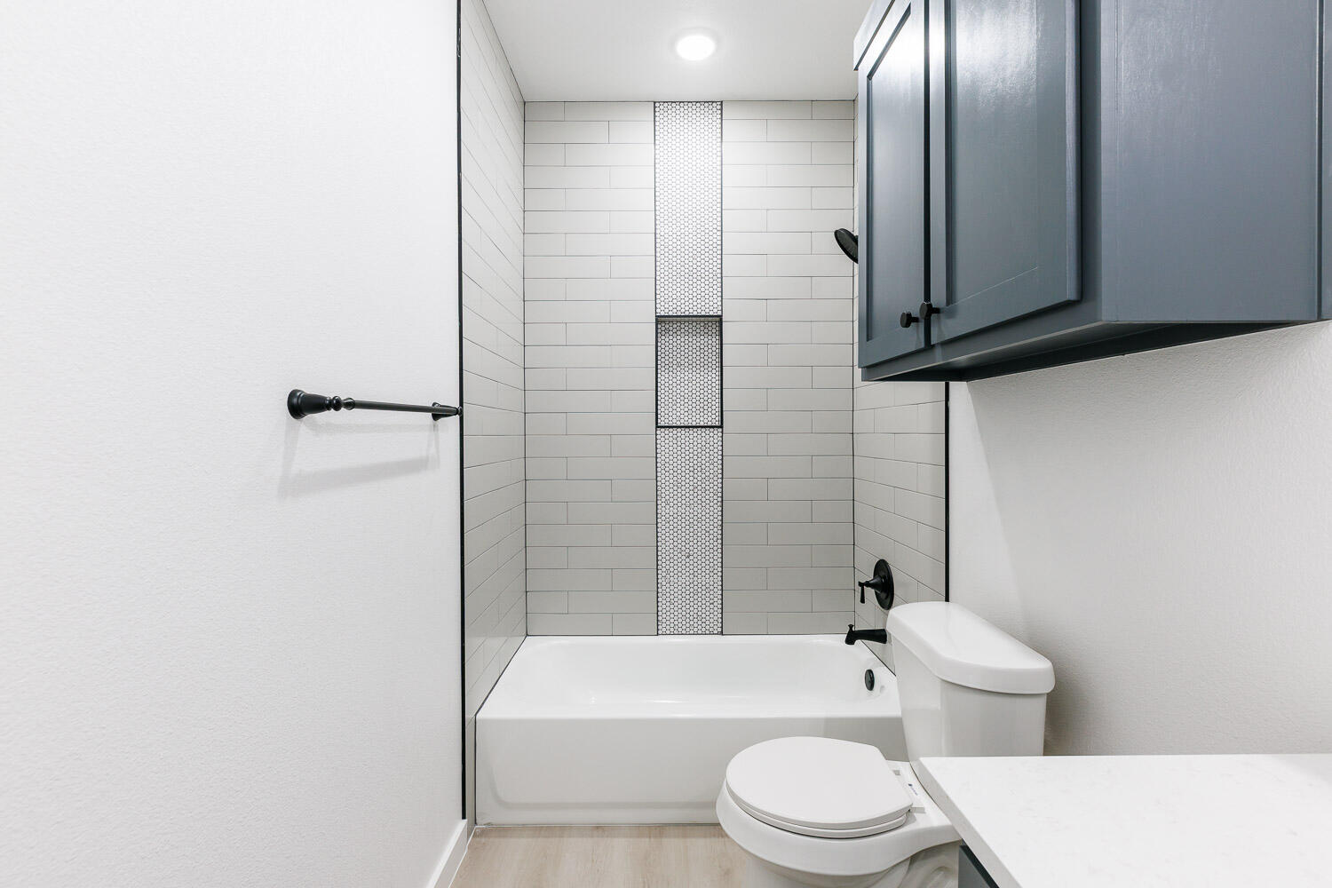1704 Elkhart Avenue, Unit A Lubbock, TX 79416 - Photo 26 of 44 a bathroom with a toilet a sink and bathtub