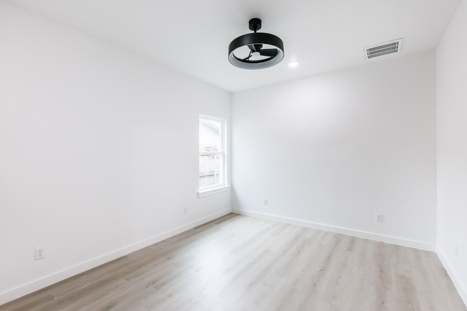 1704 Elkhart Avenue, Unit A Lubbock, TX 79416 - Photo 29 of 44 a view of wooden floor and a window