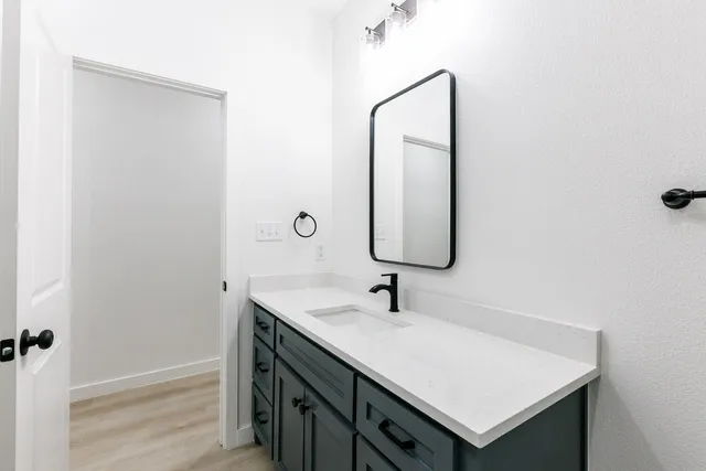 a bathroom with a sink and a mirror