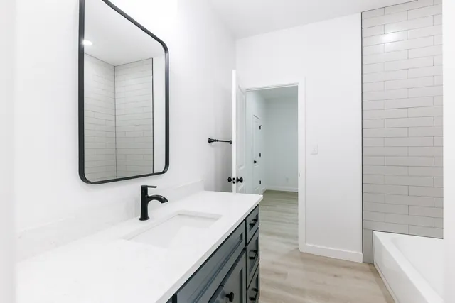 a bathroom with a sink and a bathtub