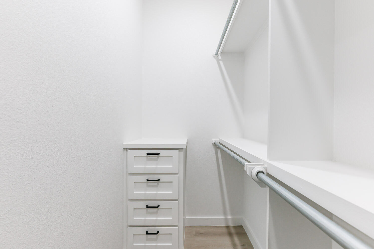 1704 Elkhart Avenue, Unit A Lubbock, TX 79416 - Photo 36 of 44 a view of walk in closet with empty racks