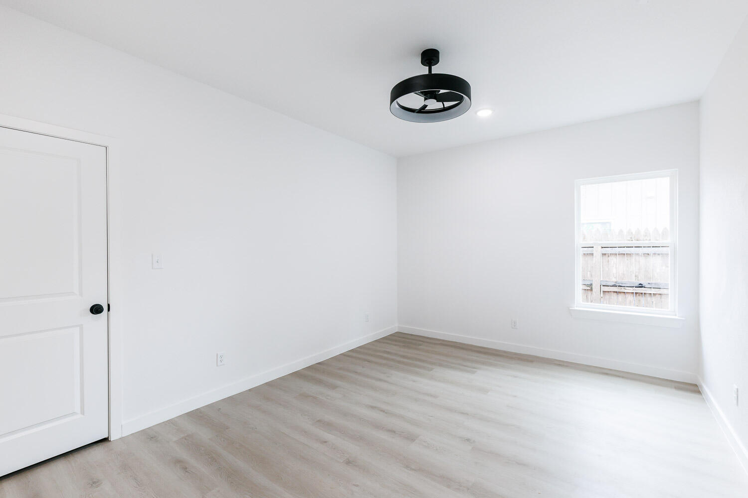 1704 Elkhart Avenue, Unit A Lubbock, TX 79416 - Photo 37 of 44 an empty room with a window