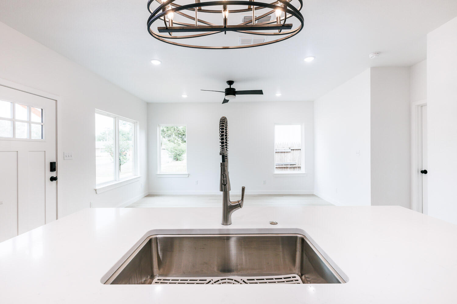 1704 Elkhart Avenue, Unit A Lubbock, TX 79416 - Photo 8 of 44 a view of a kitchen with a sink and chandelier