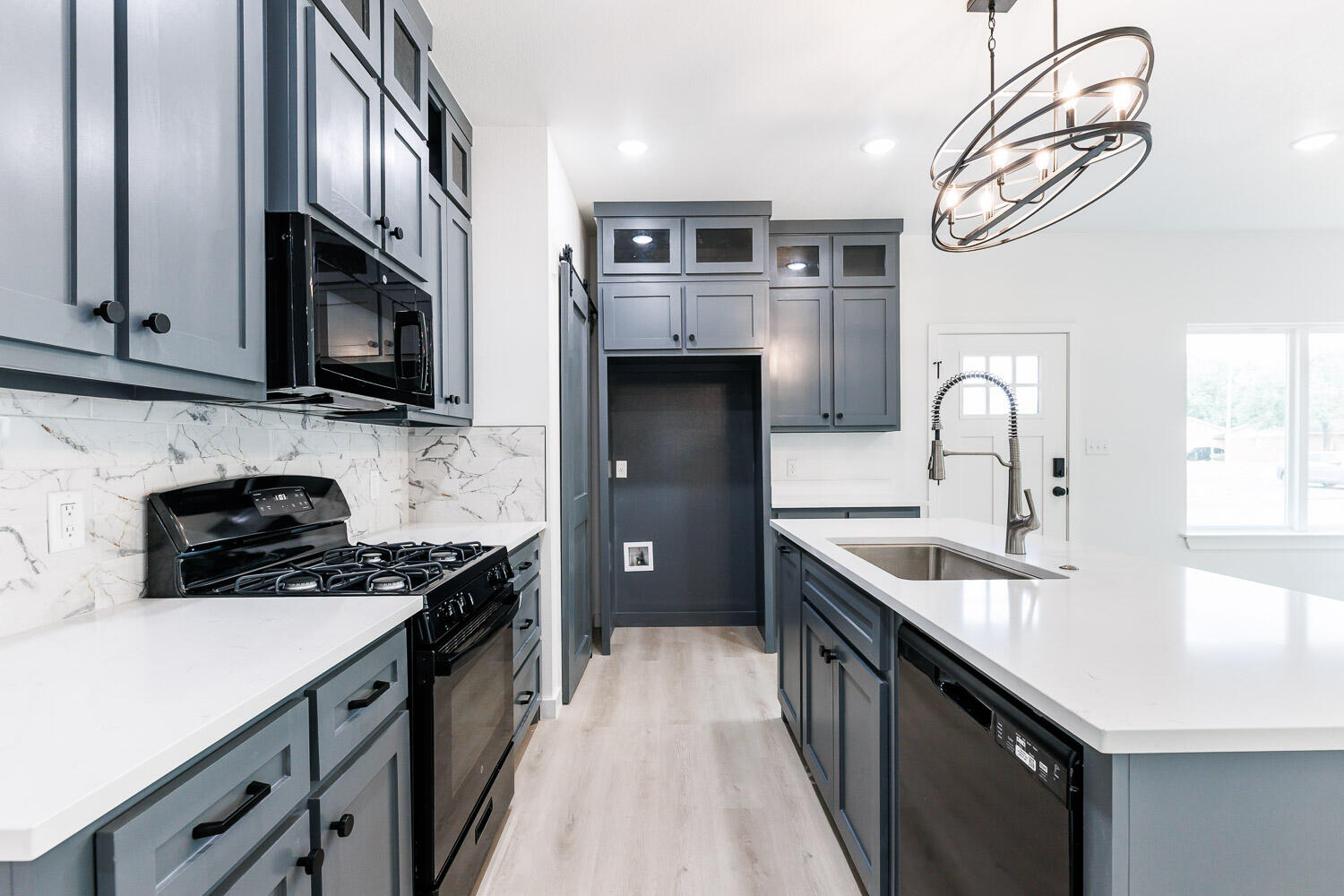 1704 Elkhart Avenue, Unit A Lubbock, TX 79416 - Photo 10 of 44 a kitchen with stainless steel appliances granite countertop a sink stove and refrigerator
