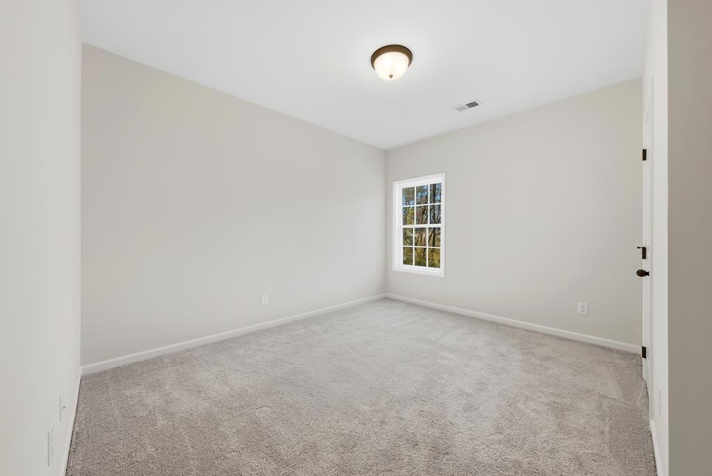 1304 McAlpine Ridge Auburn, AL 36830 - Photo 13 of 34 an empty room with windows