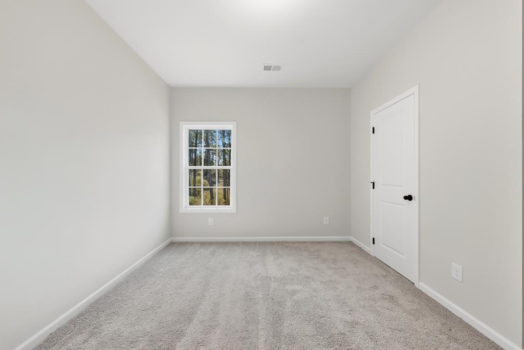 1304 McAlpine Ridge Auburn, AL 36830 - Photo 14 of 34 a view of an empty room with a window