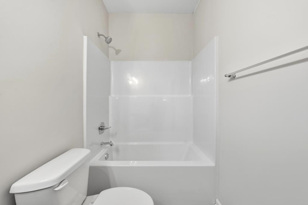 1304 McAlpine Ridge Auburn, AL 36830 - Photo 16 of 34 a bathroom with a toilet and a bathtub