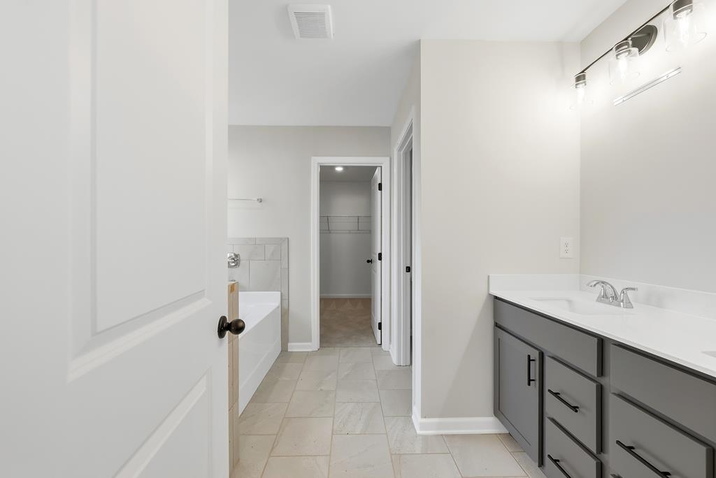 1304 McAlpine Ridge Auburn, AL 36830 - Photo 28 of 34 a bathroom with a sink and a mirror