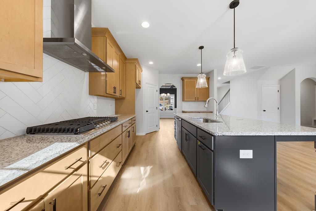 1304 McAlpine Ridge Auburn, AL 36830 - Photo 8 of 34 a large kitchen with granite countertop a sink and a stove