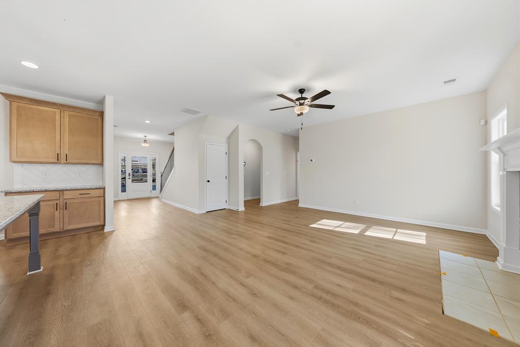 1304 McAlpine Ridge Auburn, AL 36830 - Photo 9 of 34 a view of empty room with wooden floor and fan