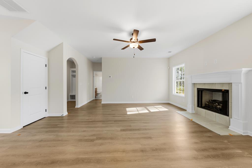 1304 McAlpine Ridge Auburn, AL 36830 - Photo 10 of 34 a view of empty room with wooden floor and fireplace