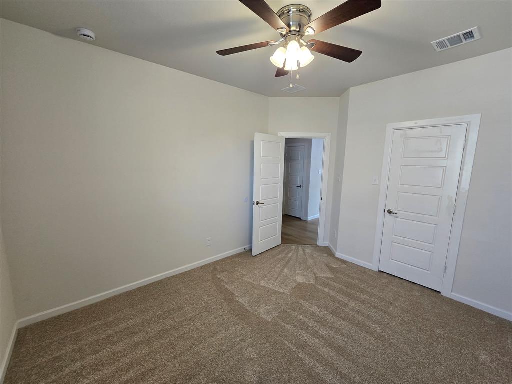 508 Williams Way Van Alstyne, TX 75495 - Photo 15 of 26 an empty room with a ceiling fan and a fan