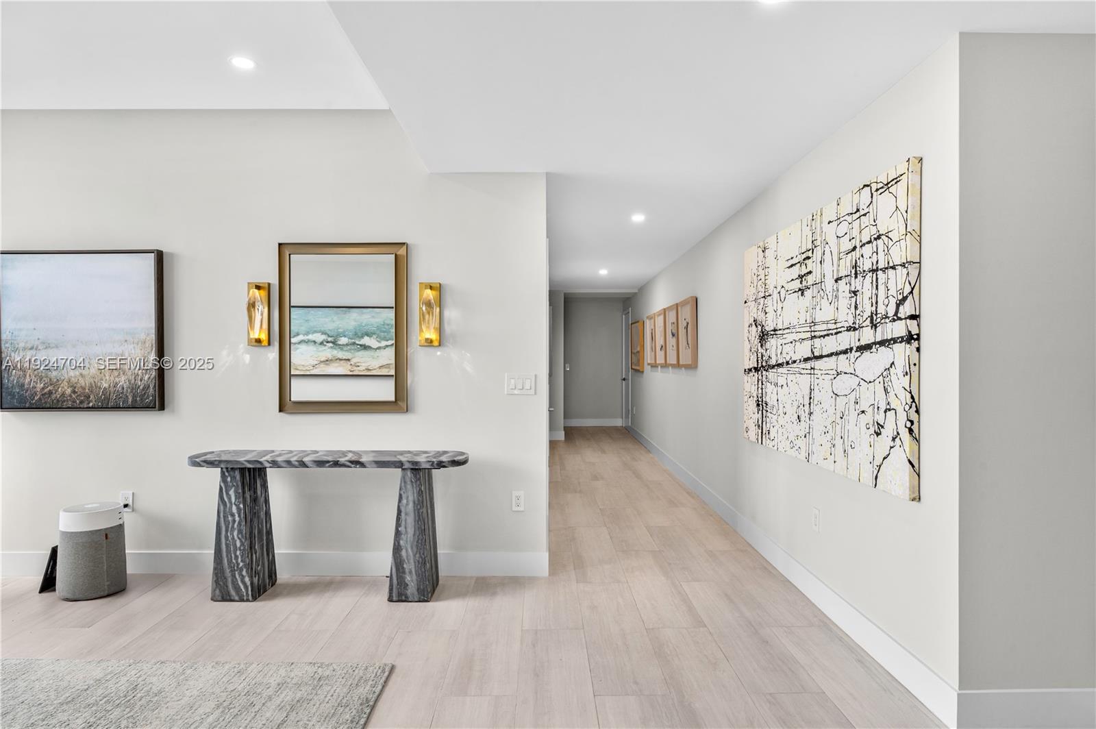 788 Northeast 23rd Street, Unit 2201 Miami, FL 33137 - Photo 12 of 29 a hallway with wooden floor and furniture