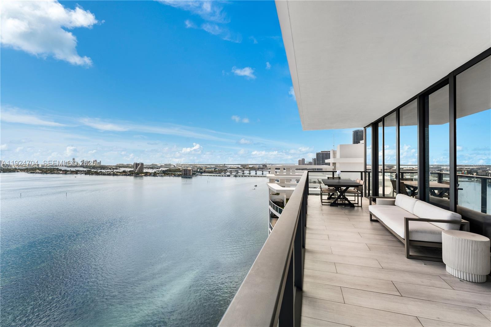 788 Northeast 23rd Street, Unit 2201 Miami, FL 33137 - Photo 15 of 29 a view of a balcony with dining table and chairs