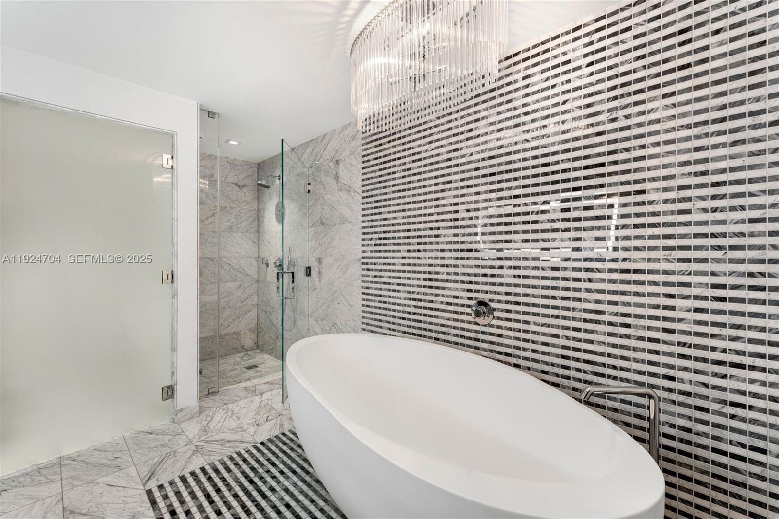 788 Northeast 23rd Street, Unit 2201 Miami, FL 33137 - Photo 9 of 29 a bathroom with a bathtub and shower