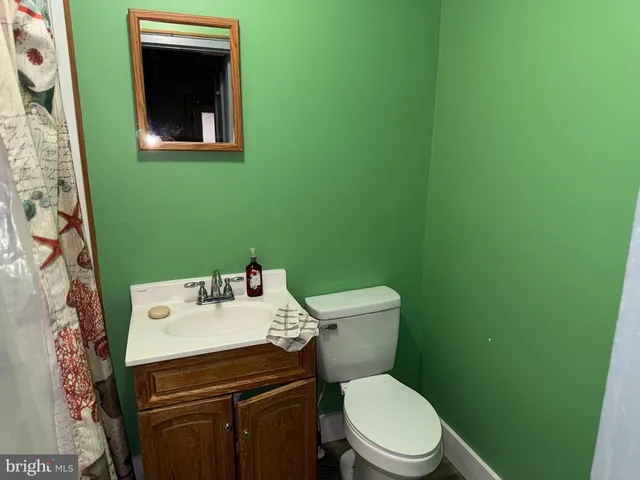 a view of a house with wooden fence