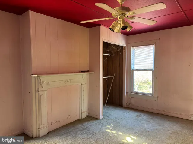 a kitchen with a table chairs refrigerator and microwave