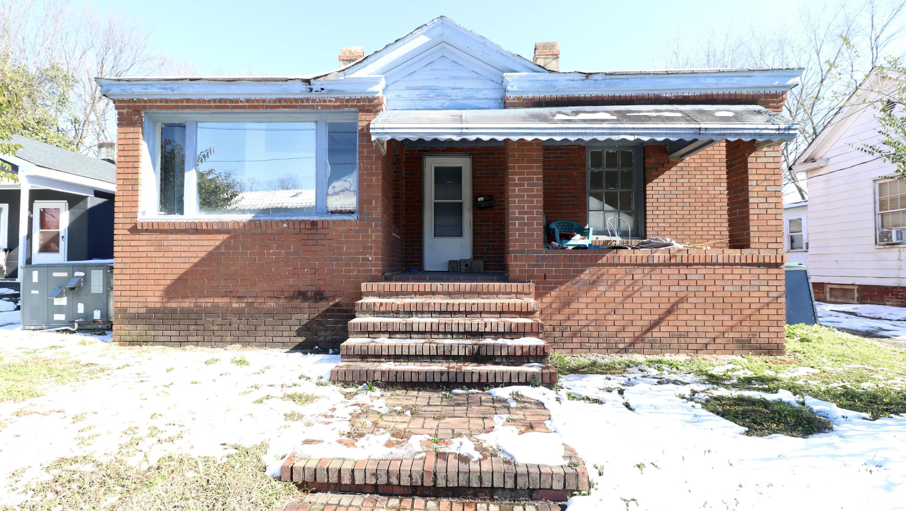 1311 South Person Street Raleigh, NC 27601 - Photo 1 of 18 a view of a house with a bench