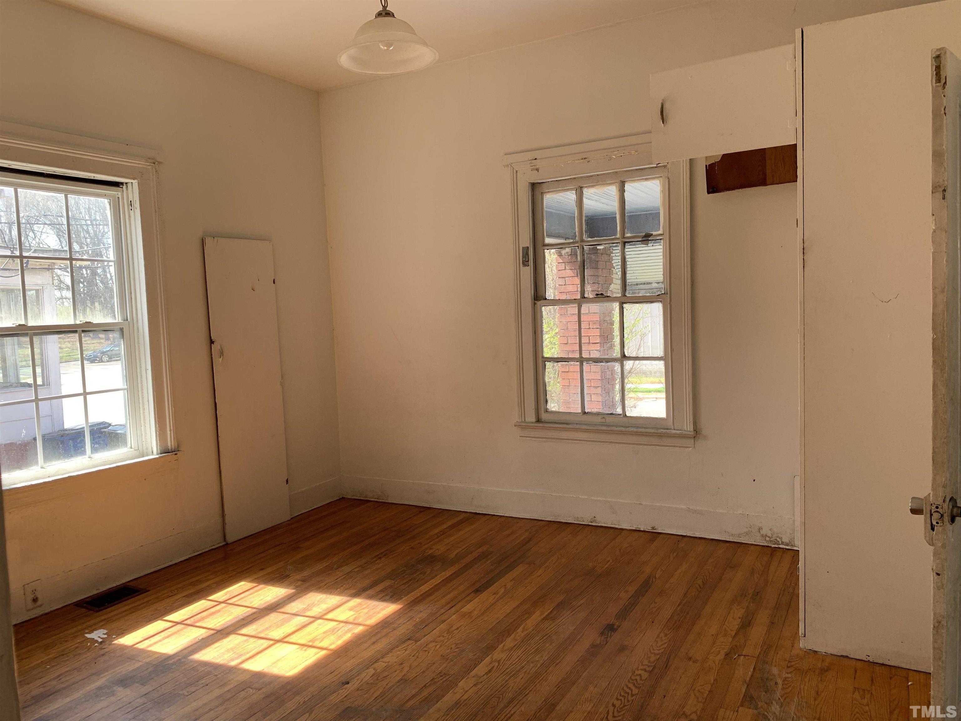 1311 South Person Street Raleigh, NC 27601 - Photo 14 of 18 a view of empty room with wooden floor and fan