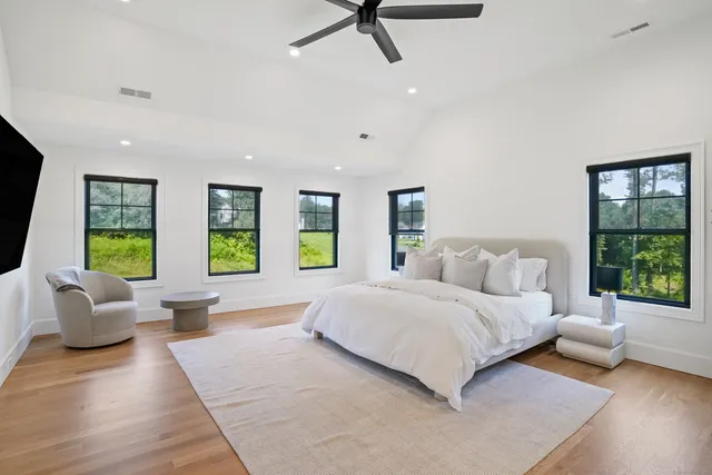 a bedroom with a large bed and a couch