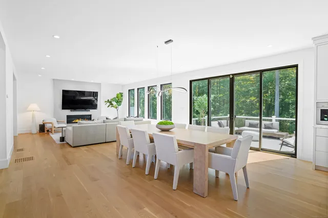 a view of a dining room with furniture window and outside view