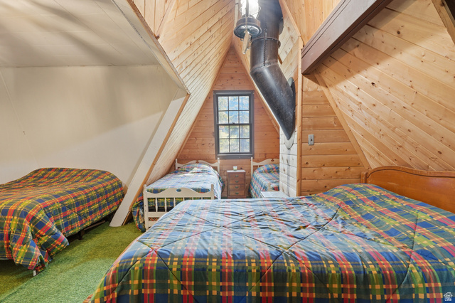 8505 South Snake Crk Road Salt Lake City, UT 84121 - Photo 26 of 67 Attic room featuring natural wood-paneled walls and sloped ceilings