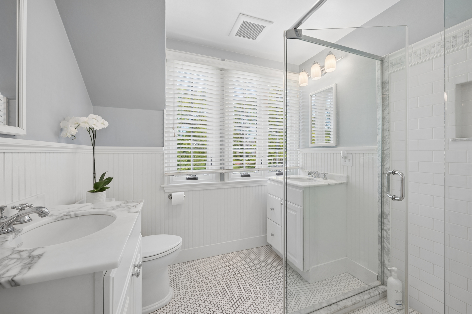 936 Sunset Road Winnetka, IL 60093 - Photo 38 of 50 a bathroom with a granite countertop sink a toilet and shower