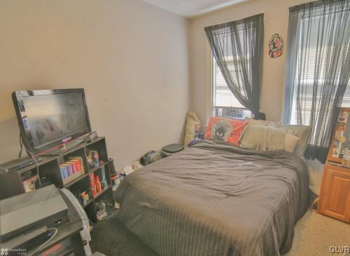 44 Easton Road Nazareth, PA 18064 - Photo 14 of 22 a bedroom with a bed and a flat tv screen on a dresser