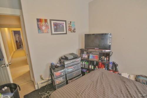 44 Easton Road Nazareth, PA 18064 - Photo 15 of 22 a bedroom with furniture and a flat screen tv