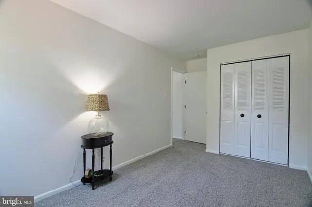 a living room with a couch and a dining table