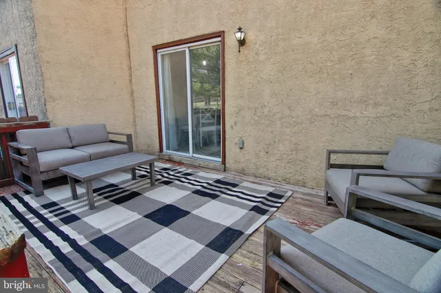 front view of a brick house with a large windows