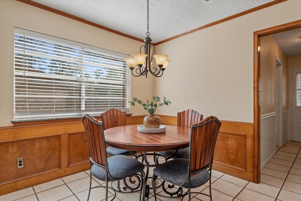 16707 Rugby Court Spring, TX 77379 - Photo 16 of 48 The breakfast area offers a large window which provides natural light to this warm and inviting space. The laundry room and half bath are located through the doorway to the right.
