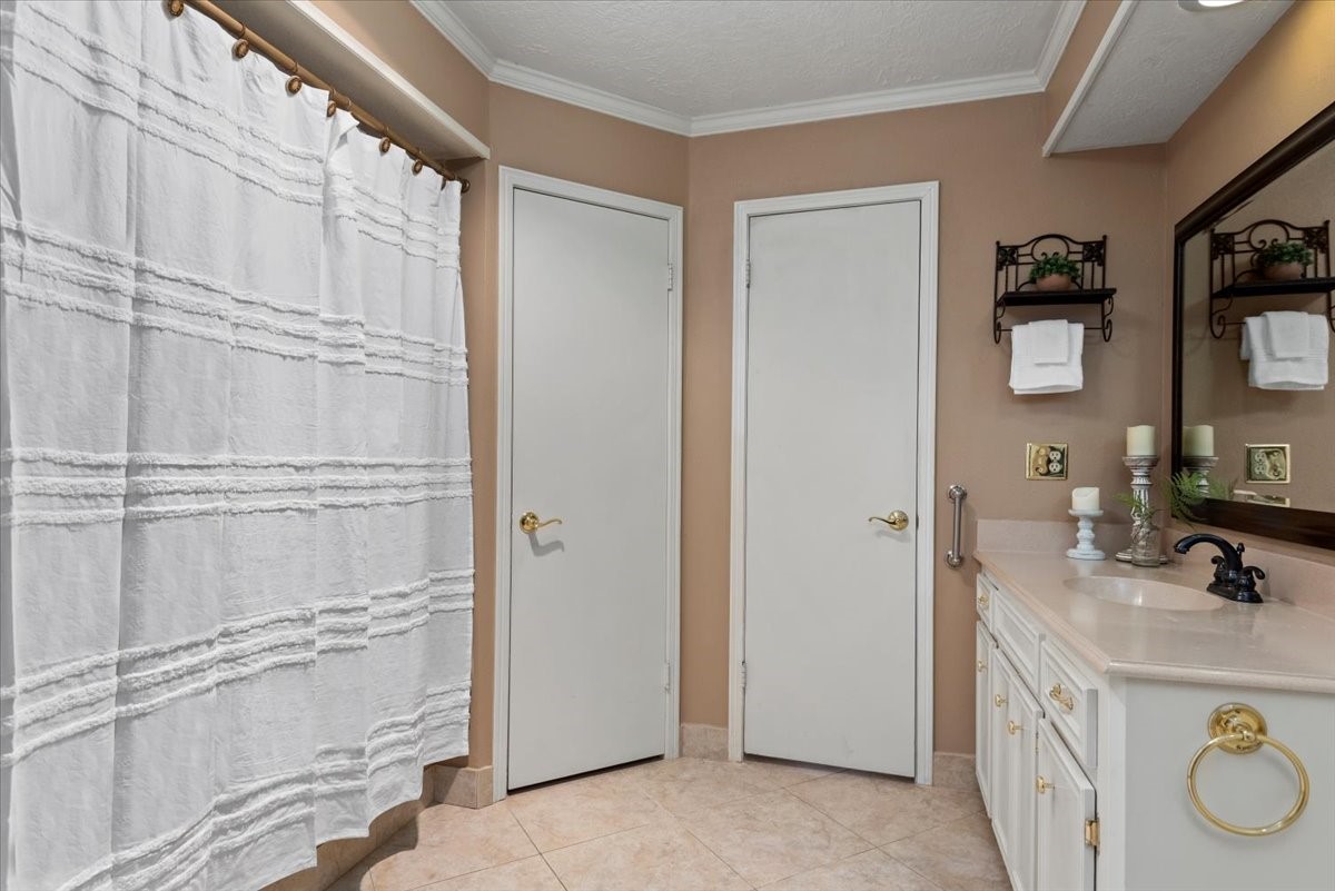 16707 Rugby Court Spring, TX 77379 - Photo 28 of 48 The primary bathroom has a separate toilet area (door to the right) and a walk-in closet (door to the left).
