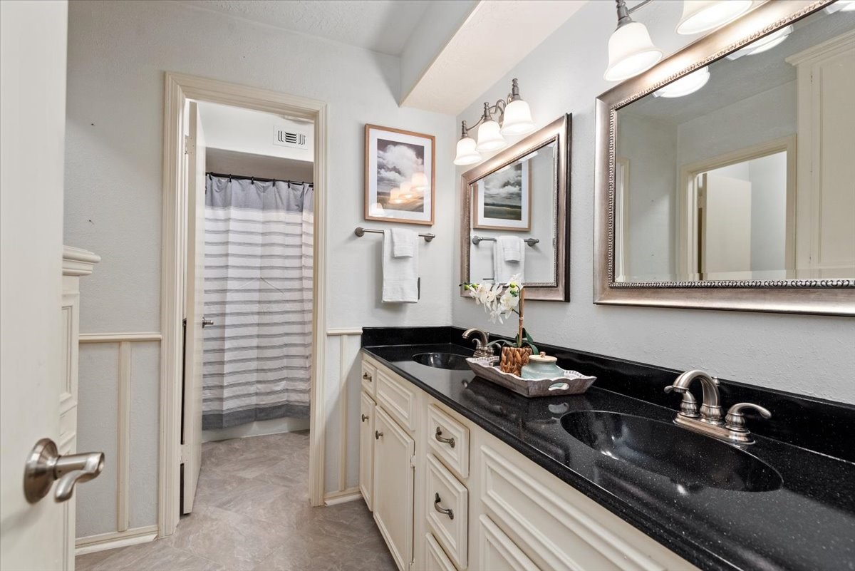 16707 Rugby Court Spring, TX 77379 - Photo 31 of 48 The upstairs guest bathroom has double sinks, granite counter tops, separate shower/tub area, AND a separate toilet area.