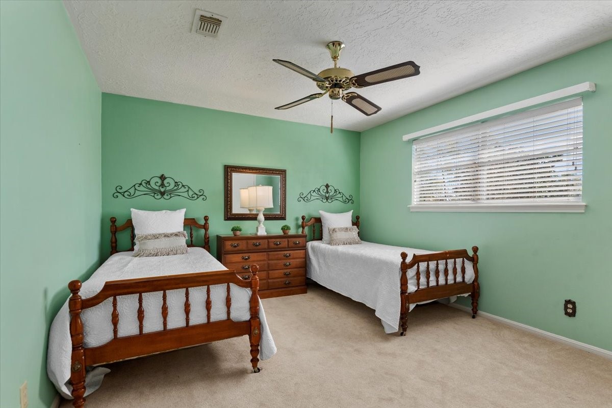 16707 Rugby Court Spring, TX 77379 - Photo 34 of 48 Guest Bedroom 3 - This upstairs bedroom has a walk-in closet, ceiling fan, large window and plenty of room for your furniture.