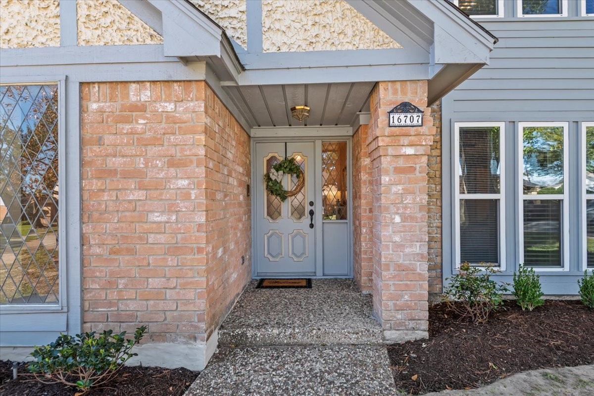 16707 Rugby Court Spring, TX 77379 - Photo 4 of 48 The covered front porch entry is inviting to all guests that visit this home with the solid wood door and decorative glass.