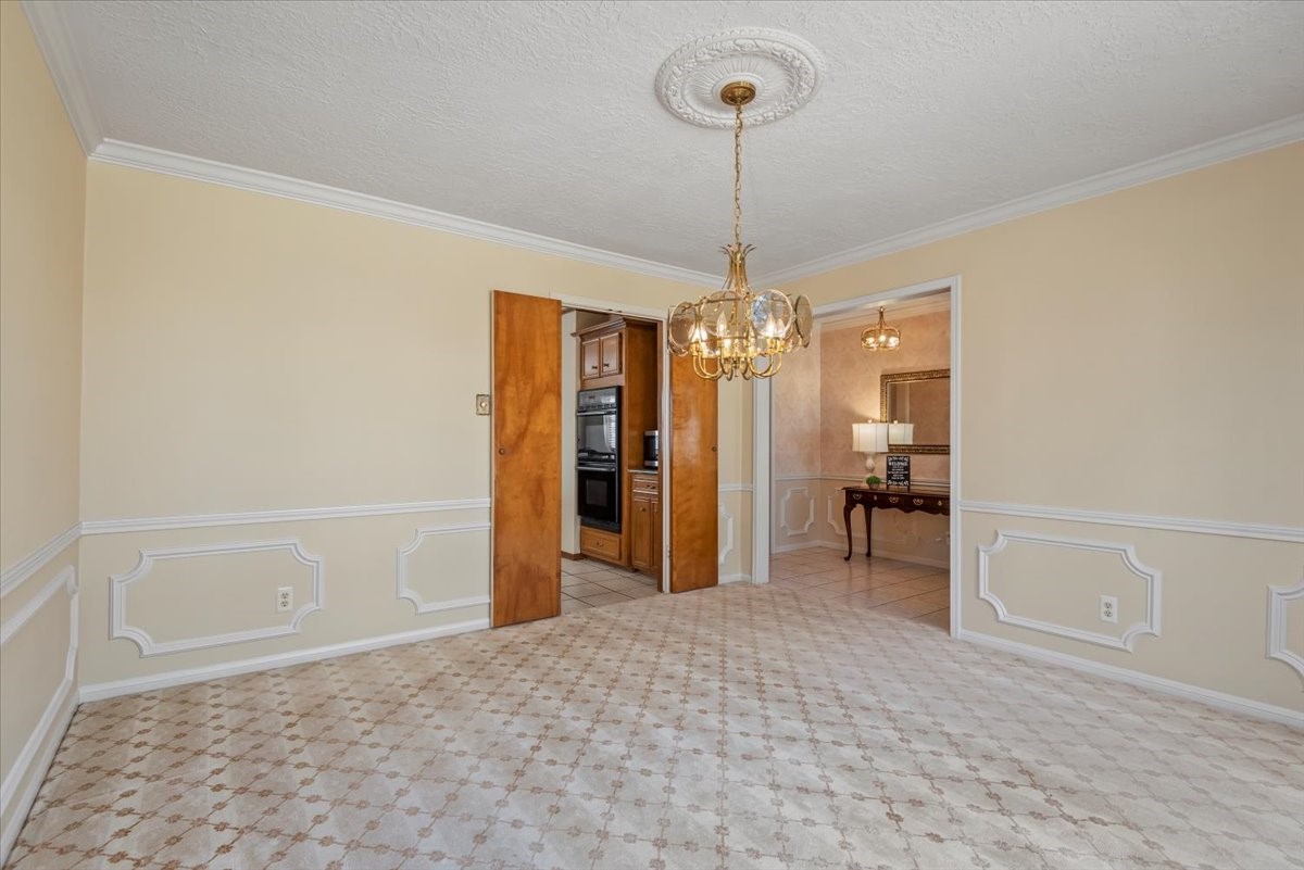 16707 Rugby Court Spring, TX 77379 - Photo 10 of 48 The double doors in the formal dining room will lead you to the large kitchen area.