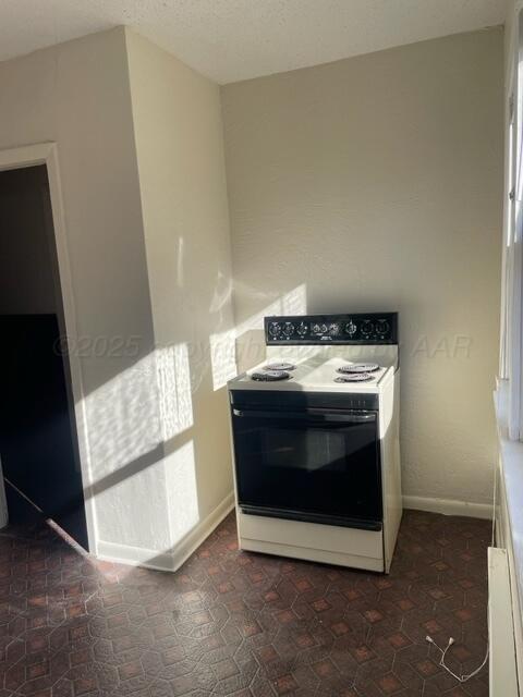 1104 South Western Street Amarillo, TX 79106 - Photo 18 of 24 a stove top oven sitting inside of a kitchen