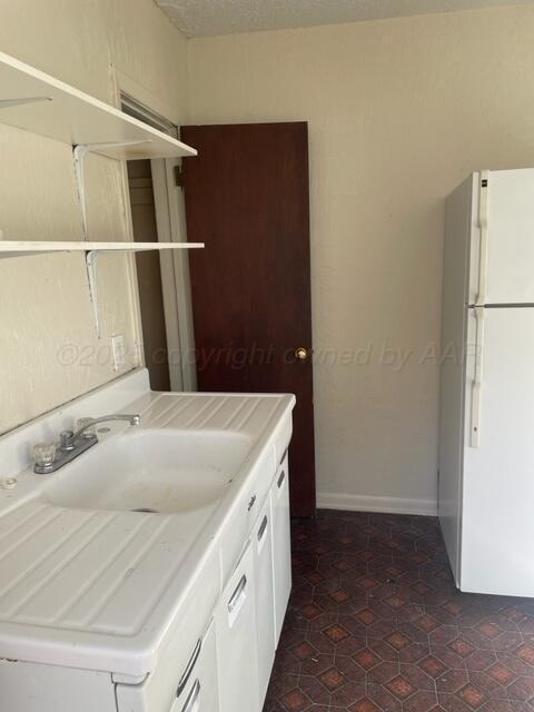 1104 South Western Street Amarillo, TX 79106 - Photo 19 of 24 a bathroom with a sink and a mirror