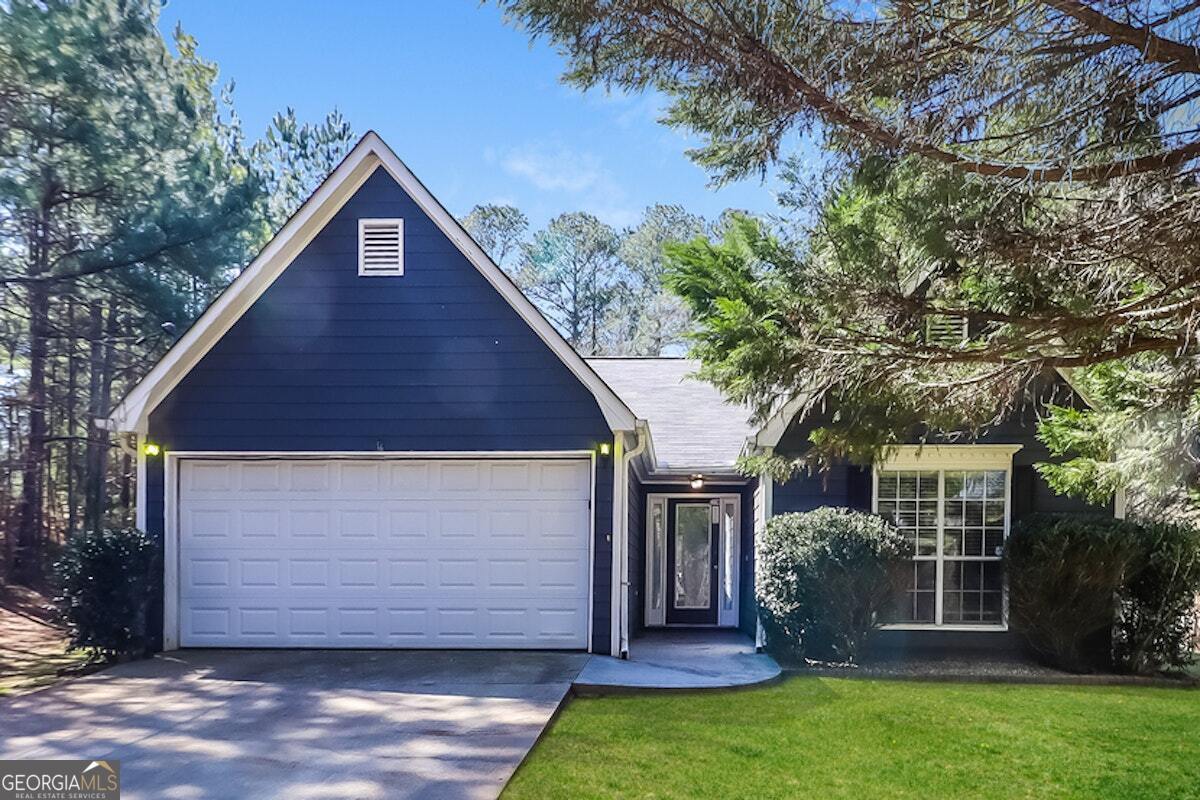 front view of a house with a yard