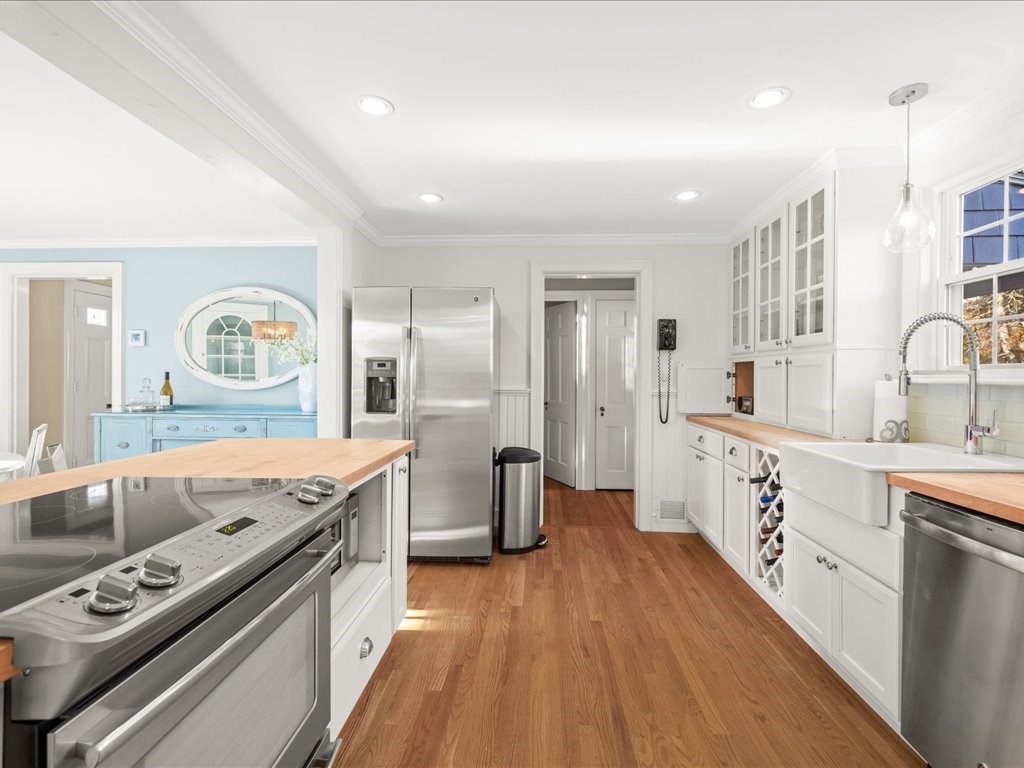 25 Pickwick Road Marblehead, MA 01945 - Photo 17 of 42 a large kitchen with stainless steel appliances granite countertop a lot of counter space and wooden floors