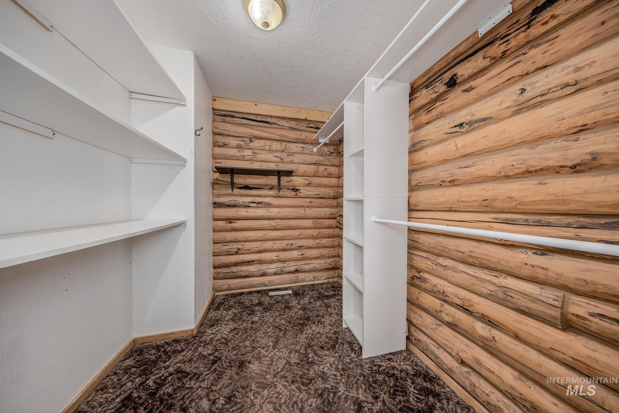 1855 Jones Road Weiser, ID 83672 - Photo 14 of 34 Walk in closet with dark colored carpet