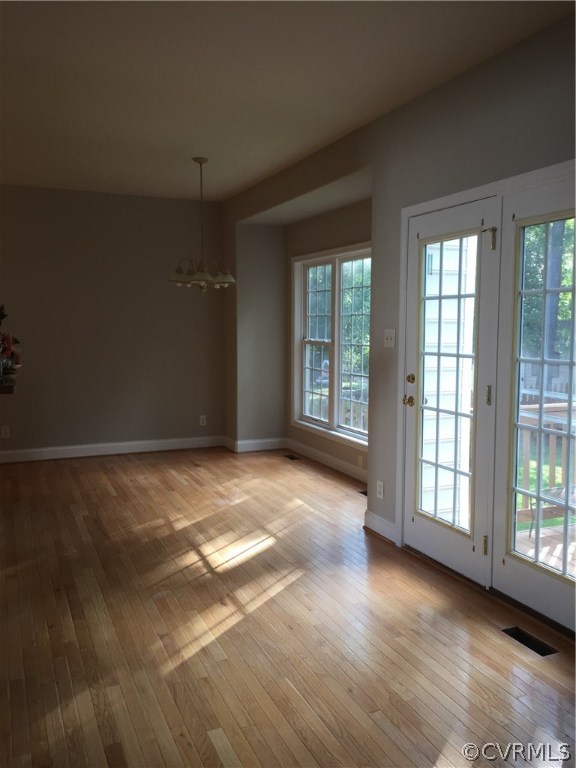 5801 Springmount Road Chesterfield, VA 23832 - Photo 2 of 4 an empty room with wooden floor and windows